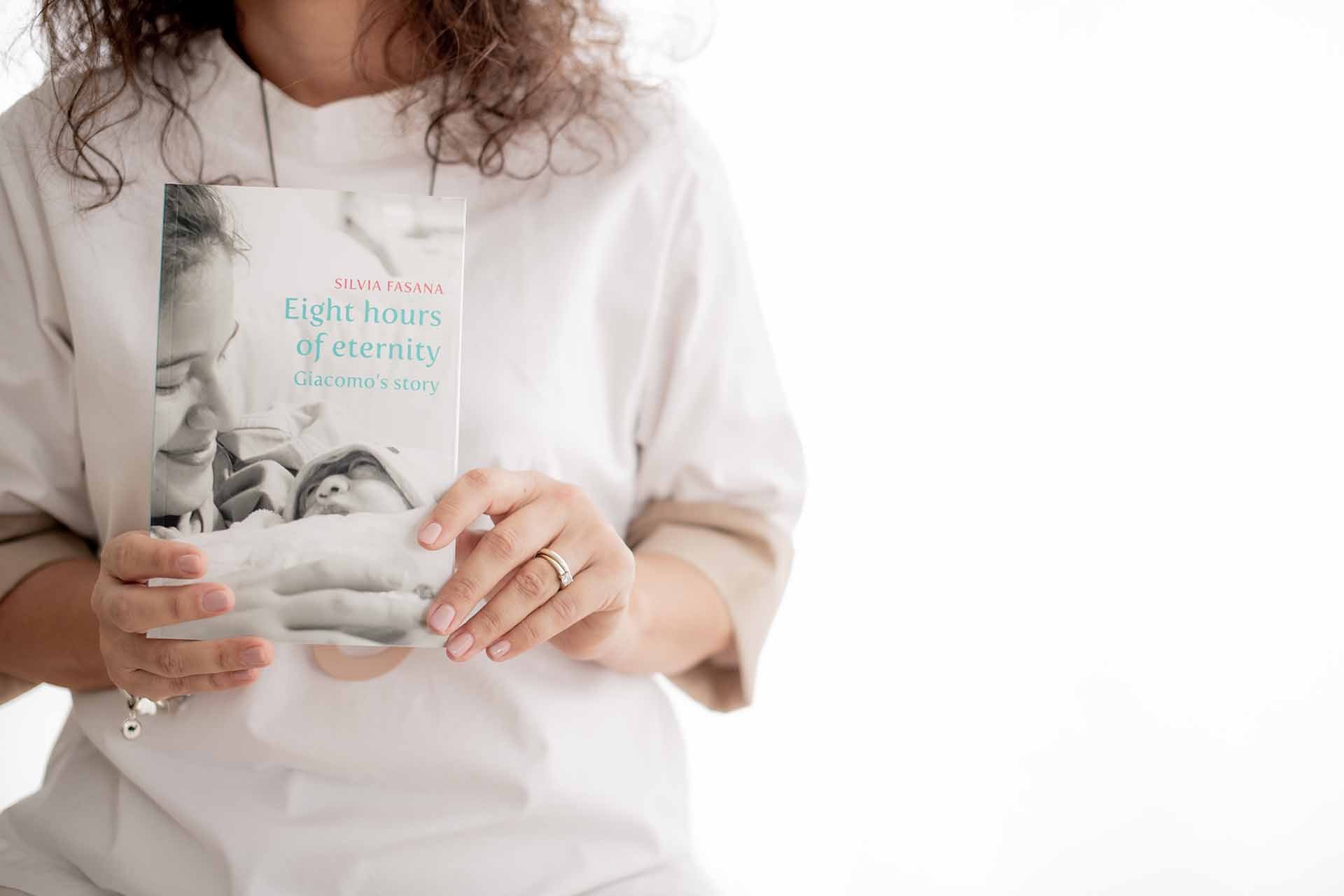 Silvia Fasana holding her book - Eight Hours of Eternity