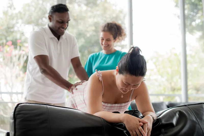 Silvia teaching a husband how to properly massage his pregnant wife.